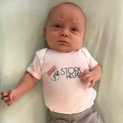baby wearing Stork Helpers shirt